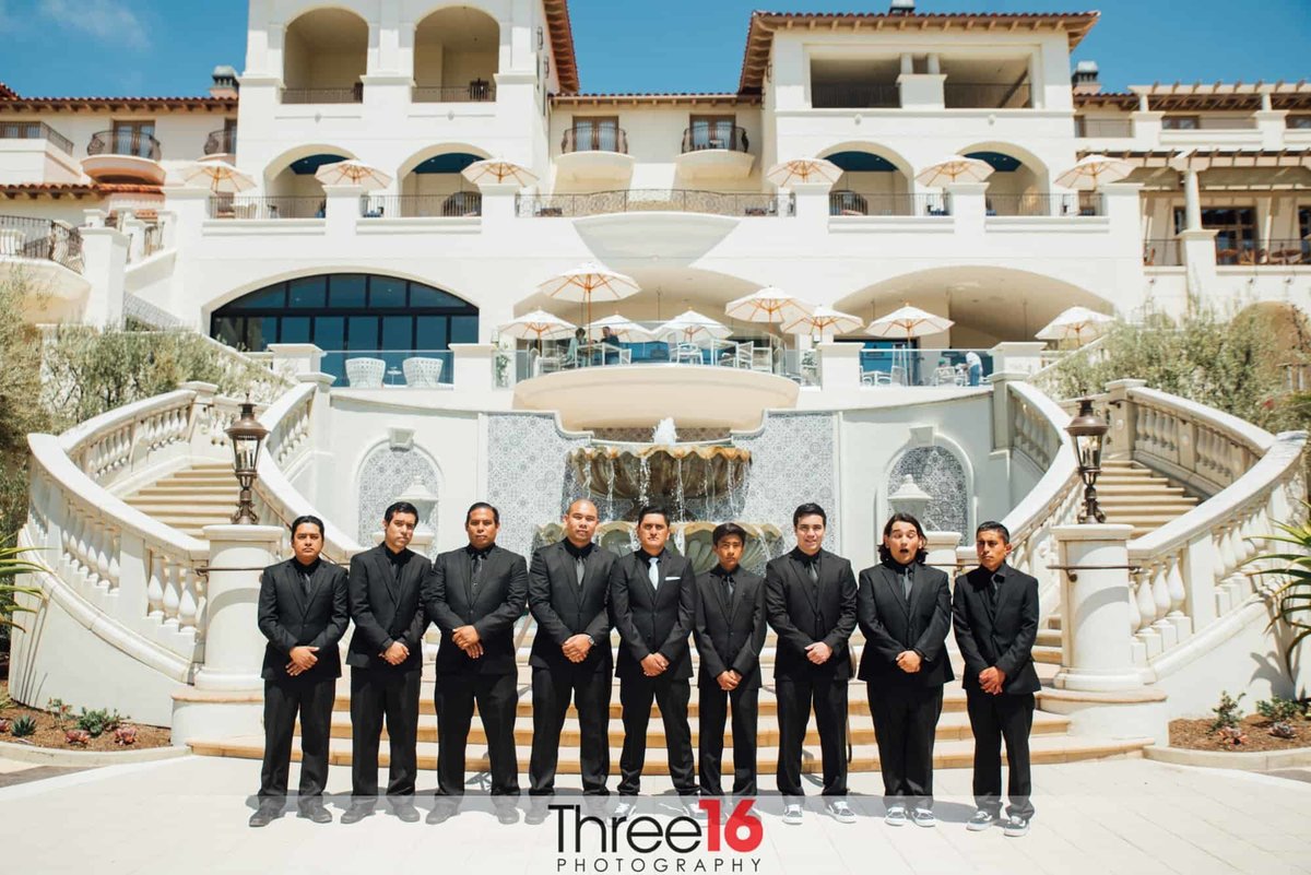 Groom and his Groomsmen pose together in front of the Salt Creek Beach Resort
