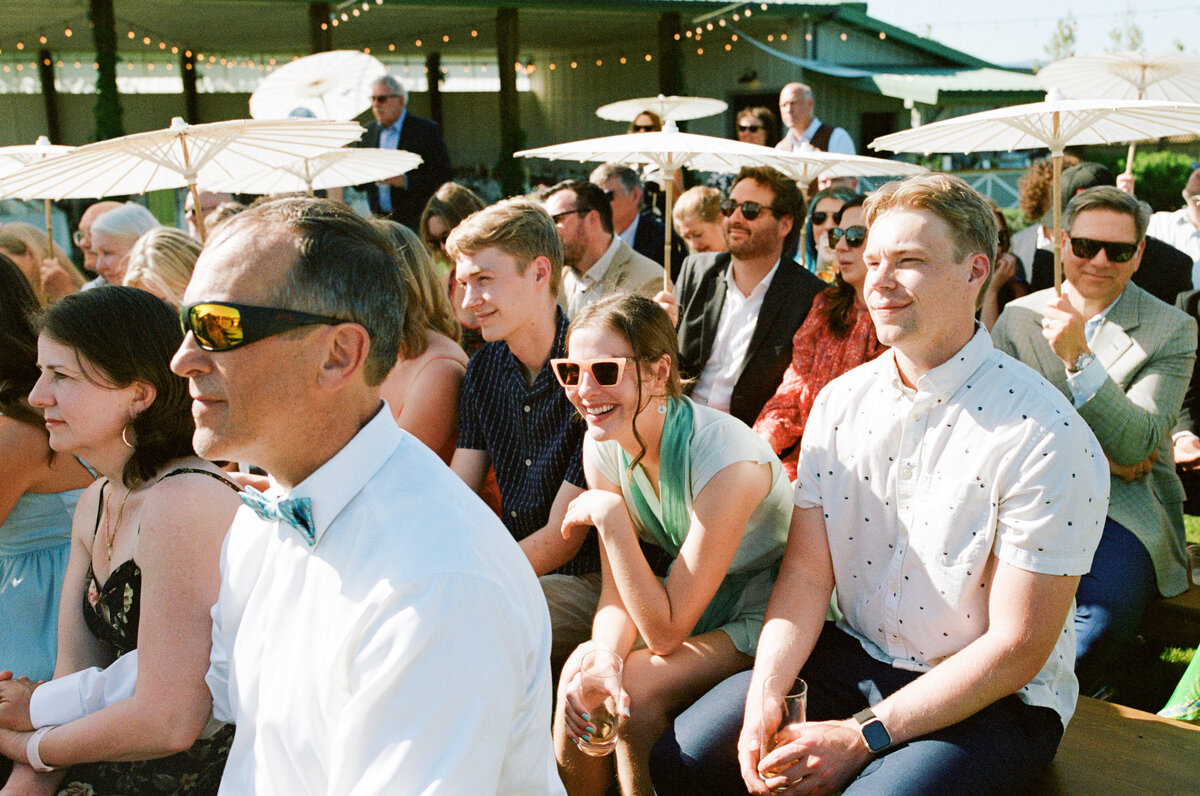 Guests laughing at ceremony at The Orchard venue in Hood River.