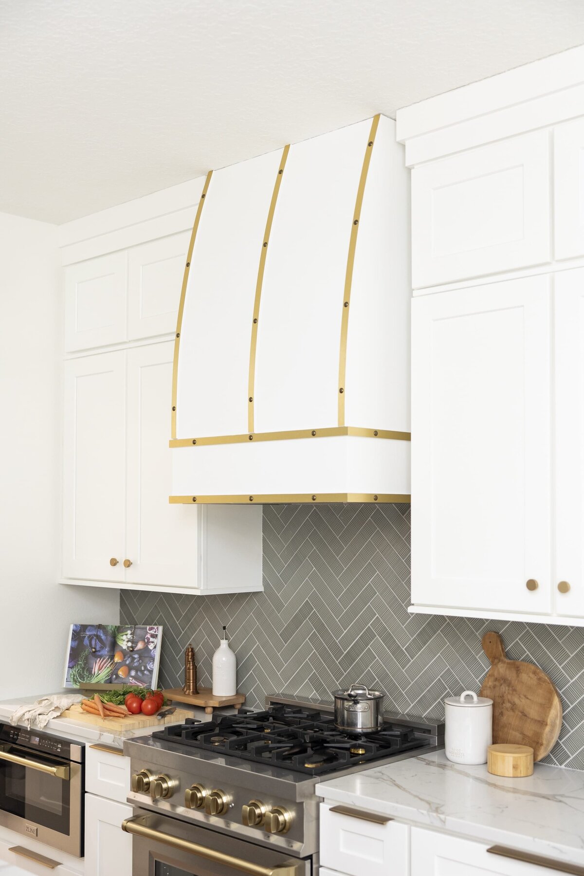 dewine design orlando interior designer belle isle kitchen with gold trimmed vent hood