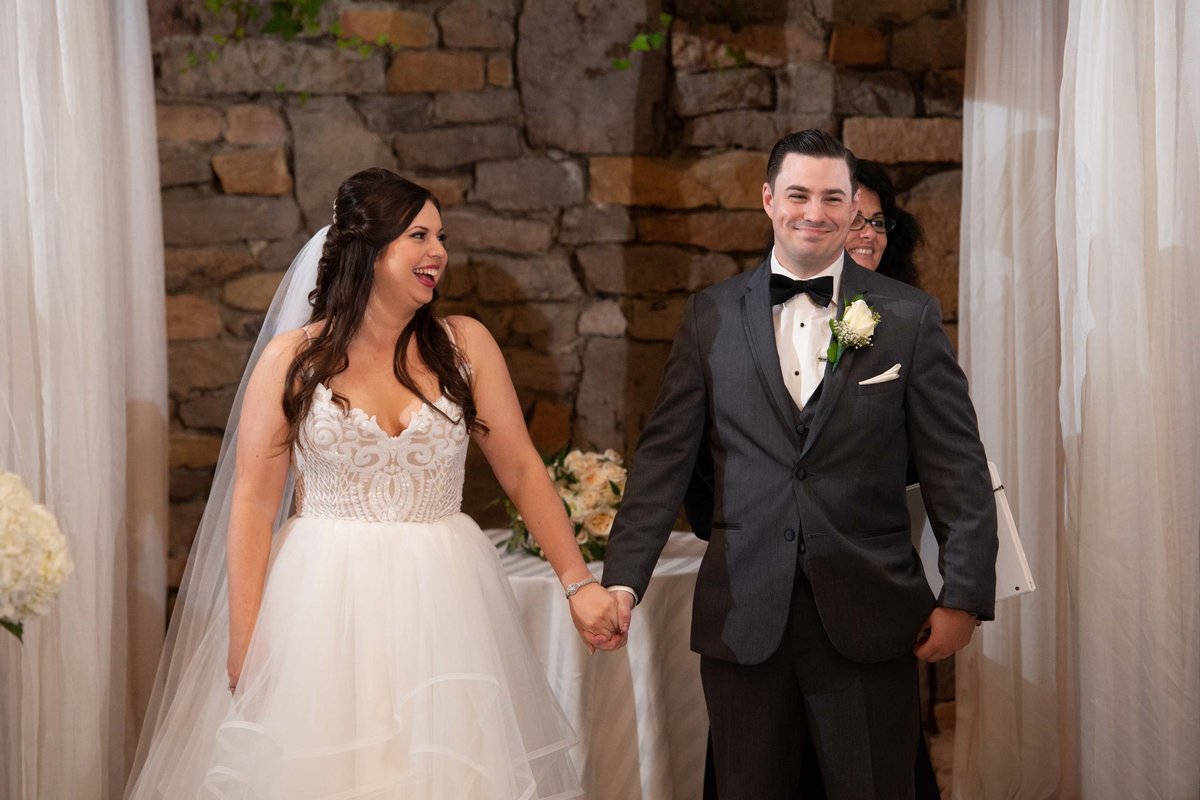 Bride and groom after their ceremony at Fox Hollow