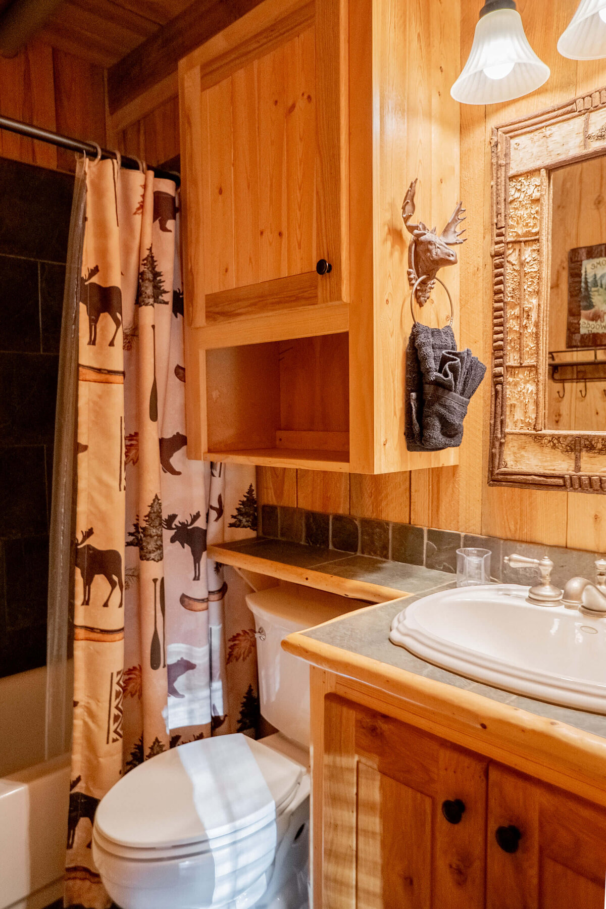 Clean bathroom with fresh linens and storage