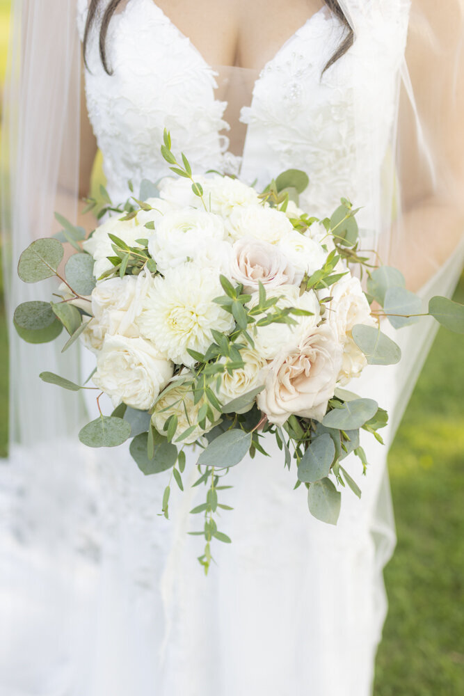 closeup of bride holding her bouquet - candlelight farms inn wedding
