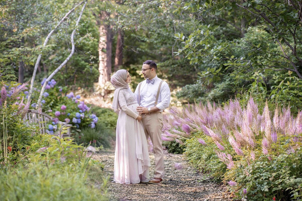 Maternity session with couple surrounded by lavender flowers
