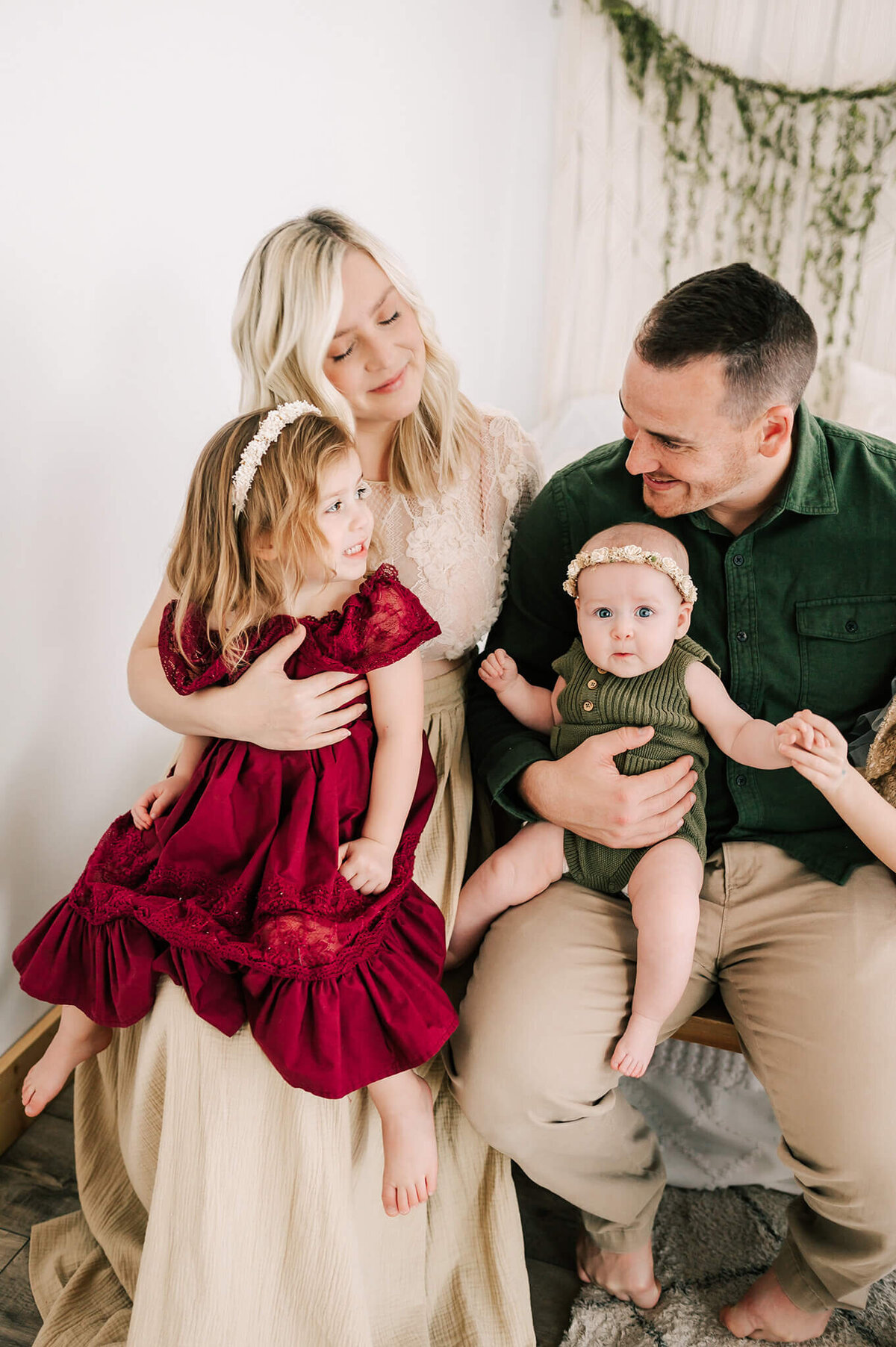 parents cuddling kids during Springfield Mo family photography session