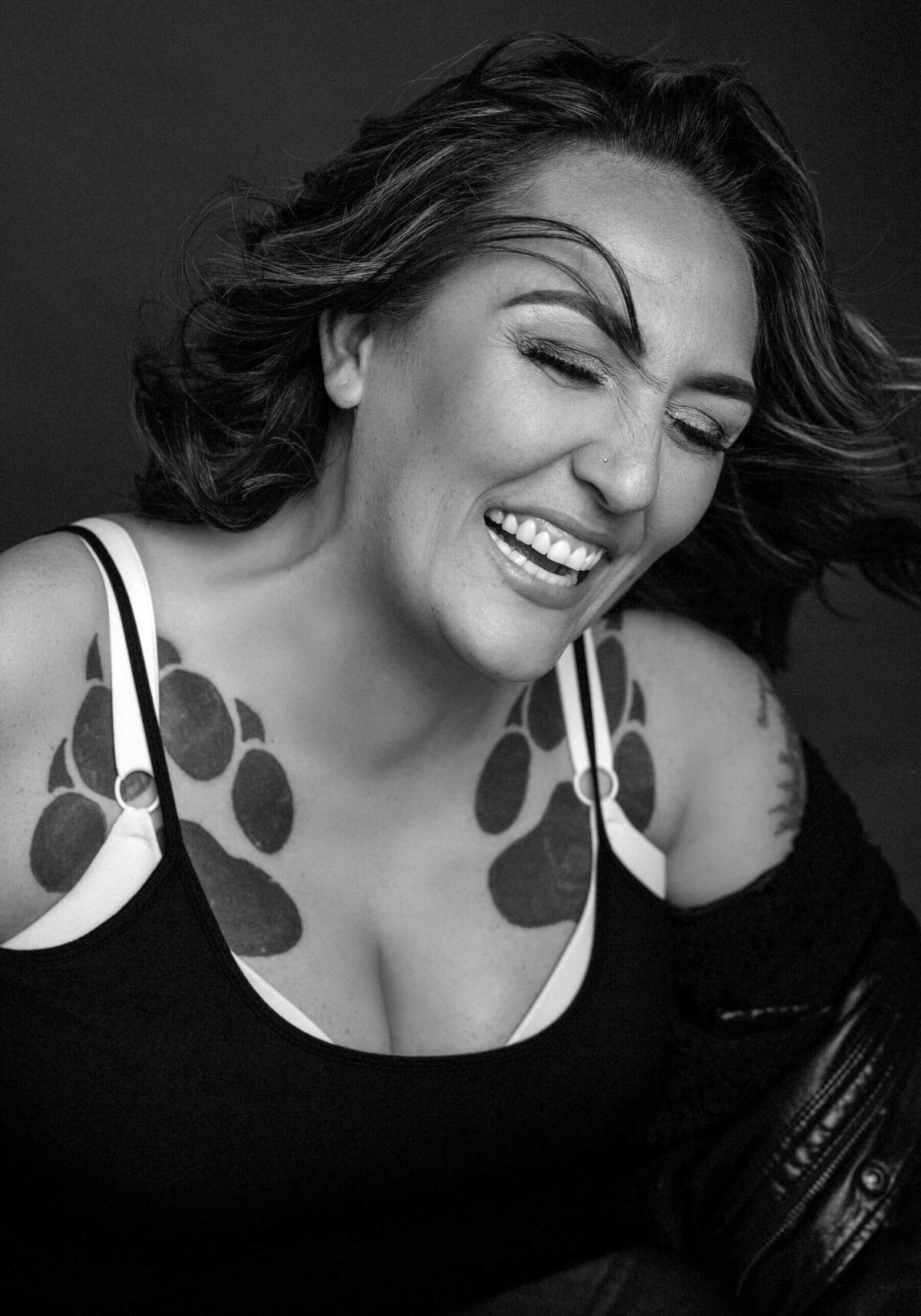 Authentic Laughter and Joy – A powerful black-and-white portrait capturing raw emotion.