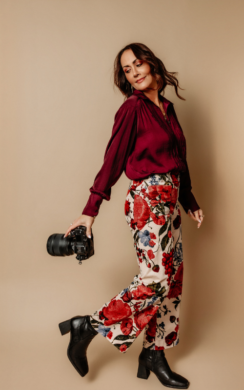 Renee Bowen, Los Angeles senior photographer and certified coach for photographers, holding her camera