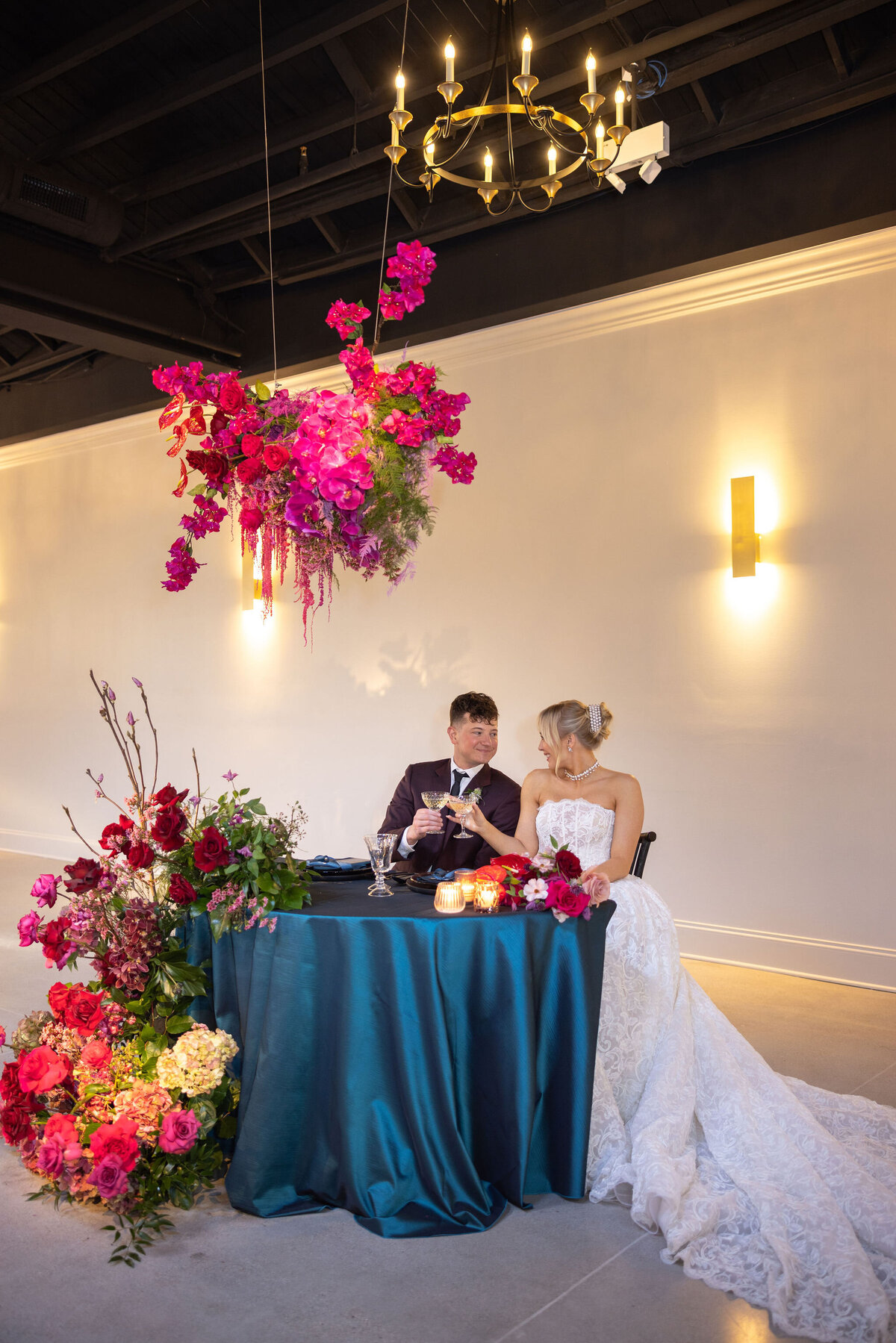 in house black and white dance floor in large reception space, timeless space with personalized floral and design