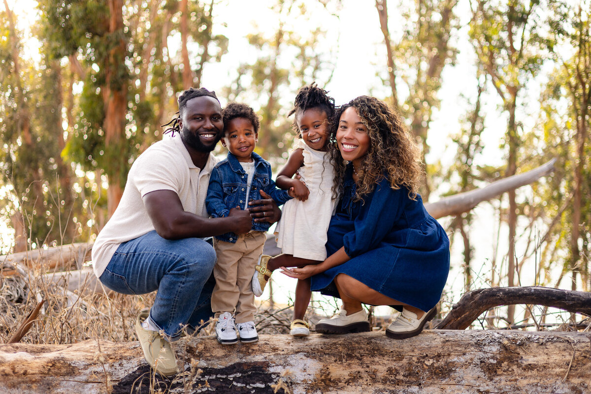 Smiling family portrait with parents and two children in Bay Area Family Portfolio – Ellobelle Photography