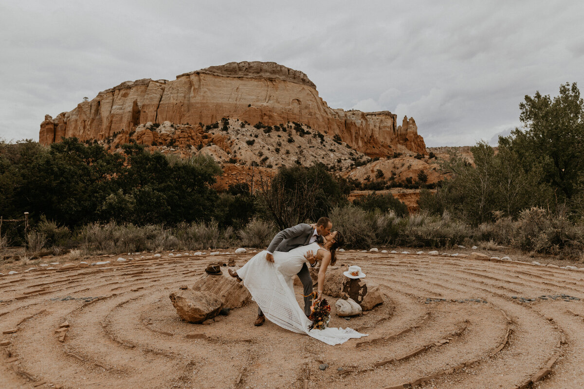 bride and groom standing in the labyrinth at Ghost Ranch