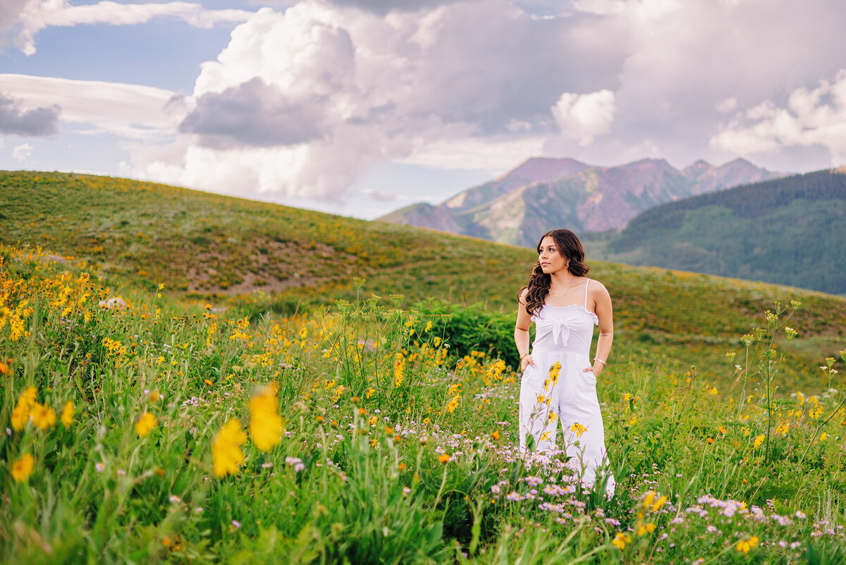 senior portraits in Colorado wildflower field