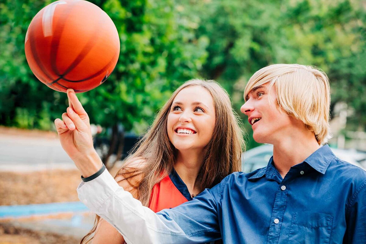 Missoula high school senior with boyfriend spinning basketball