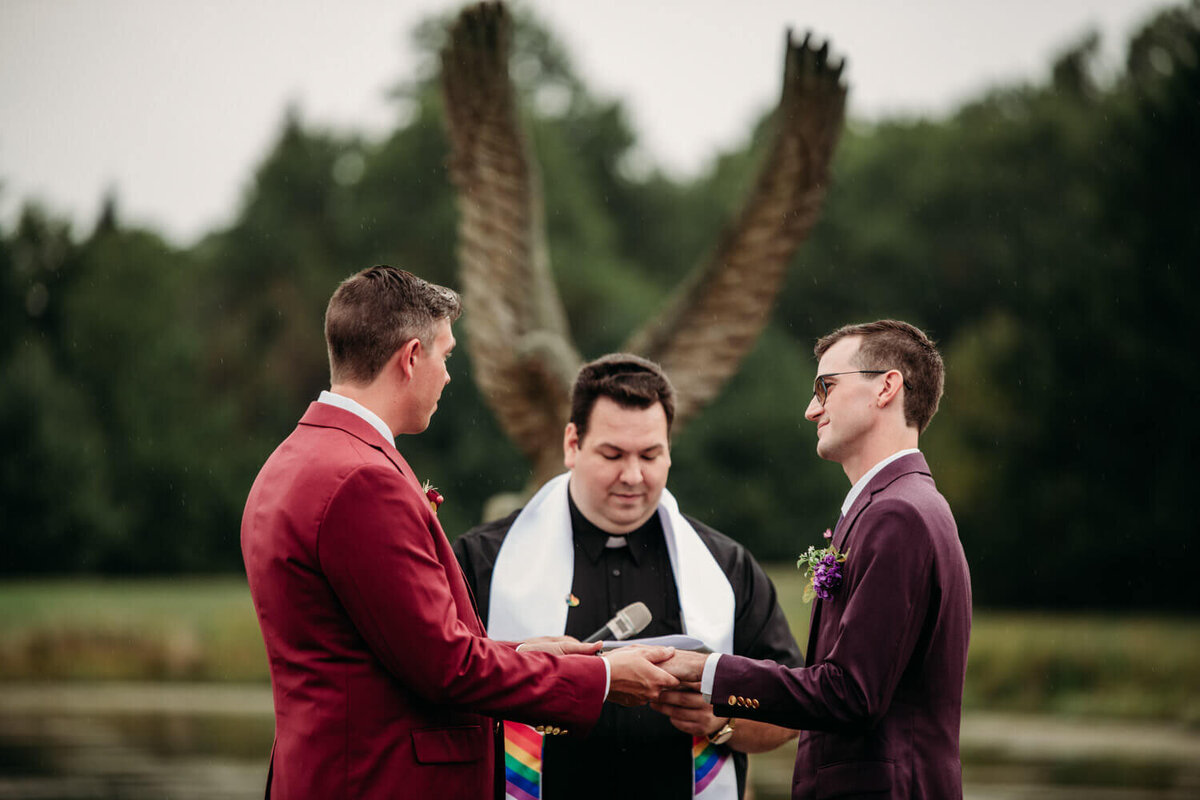 Grooms recite vows among a light rain