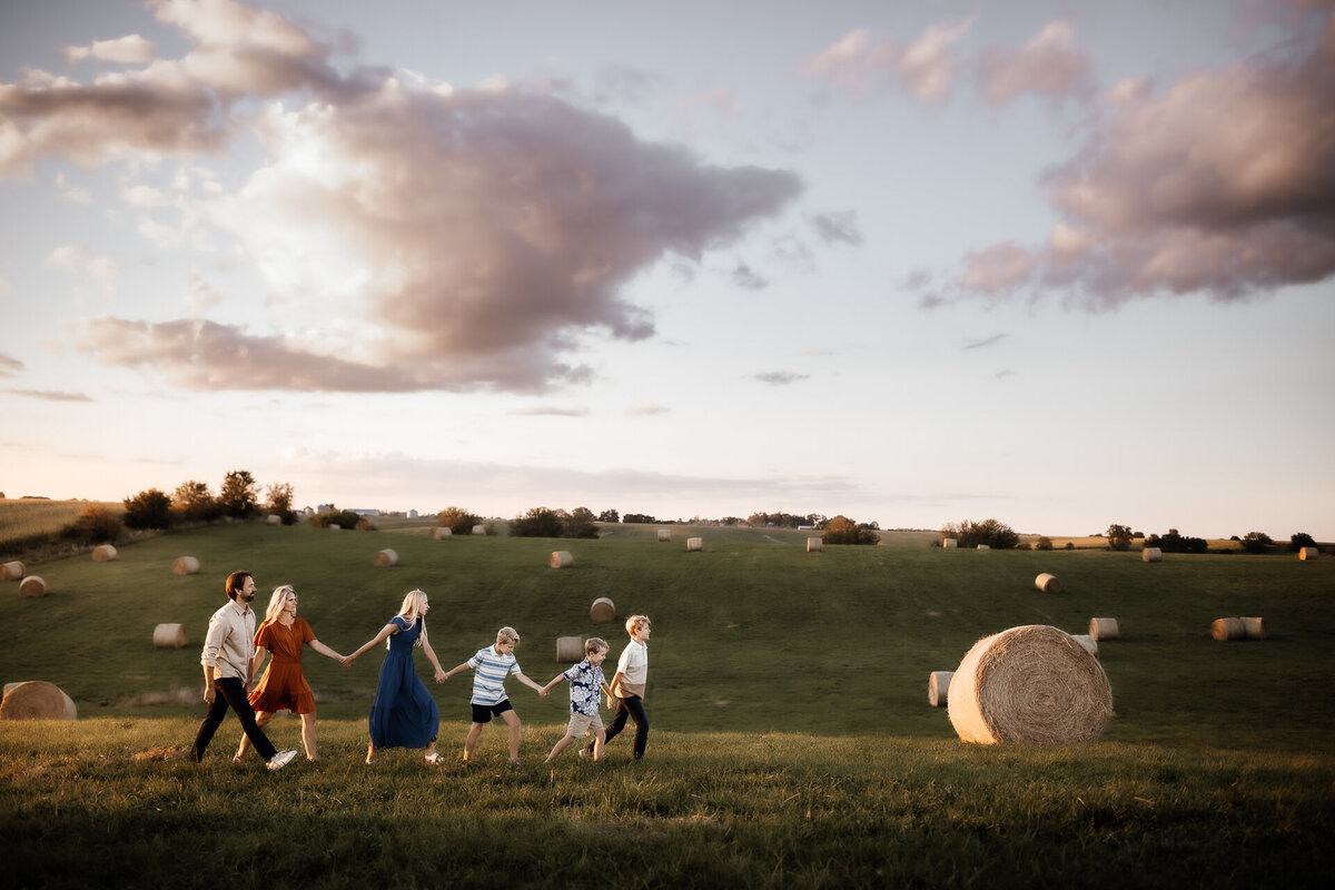 family photoshoot in hay field