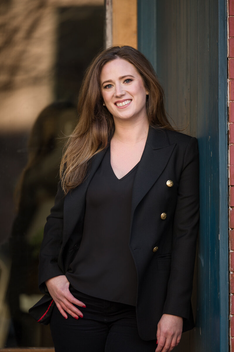 Influencer branding photo of a woman outside wearing a suit