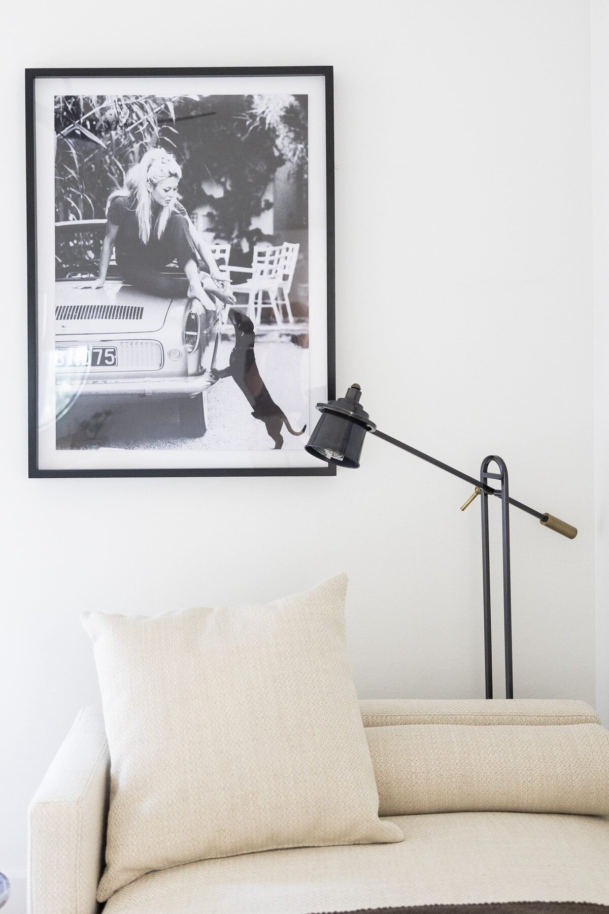 dewine design orlando interior designer belle isle black and white photograph on wall with classic white couch