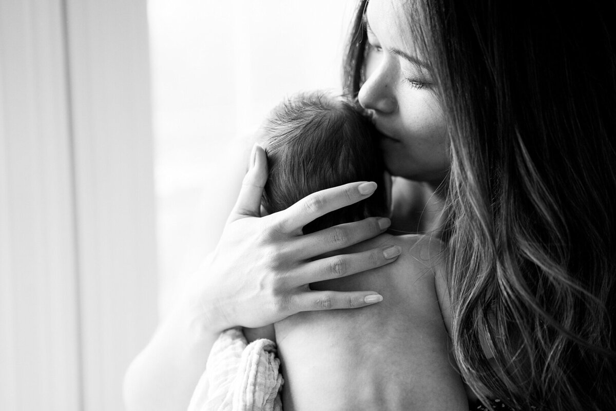 Austin newborn photographer specializing in bright and candid in-home sessions. No stiff poses—just genuine moments and memories captured beautifully.