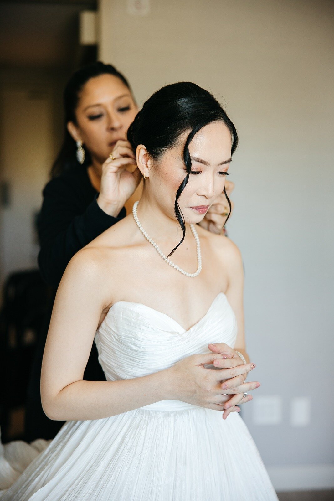 Made of honor fixing brides hair
