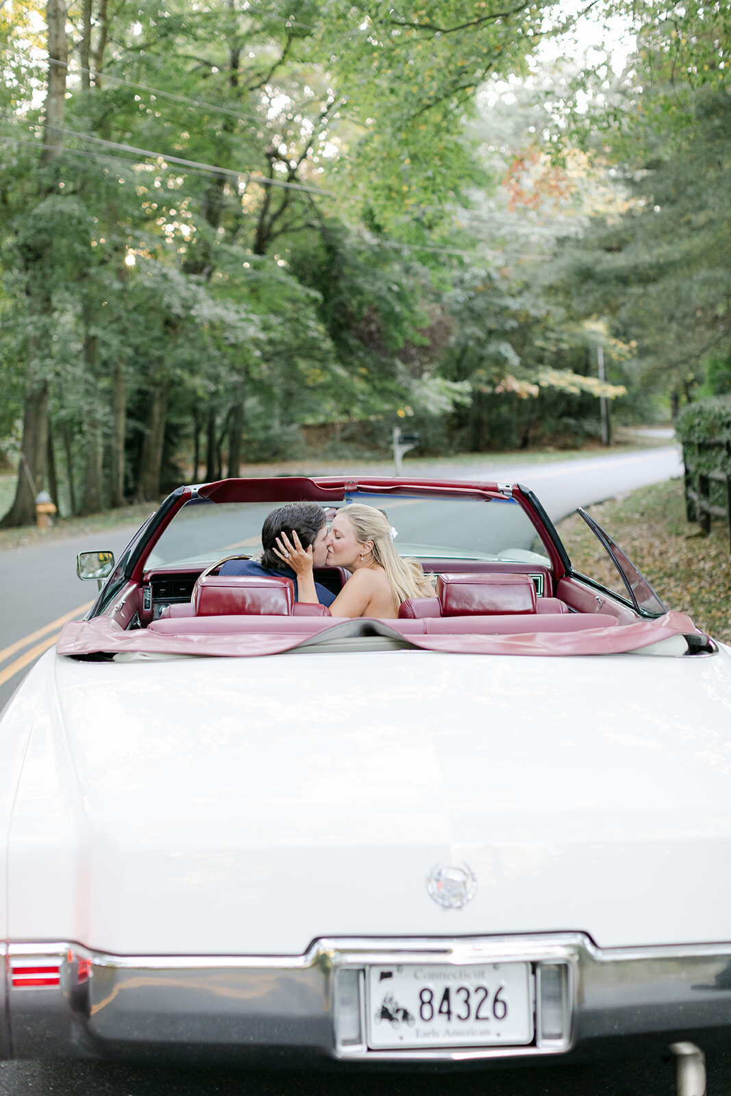 bride-groom-kiss-classic-convertible