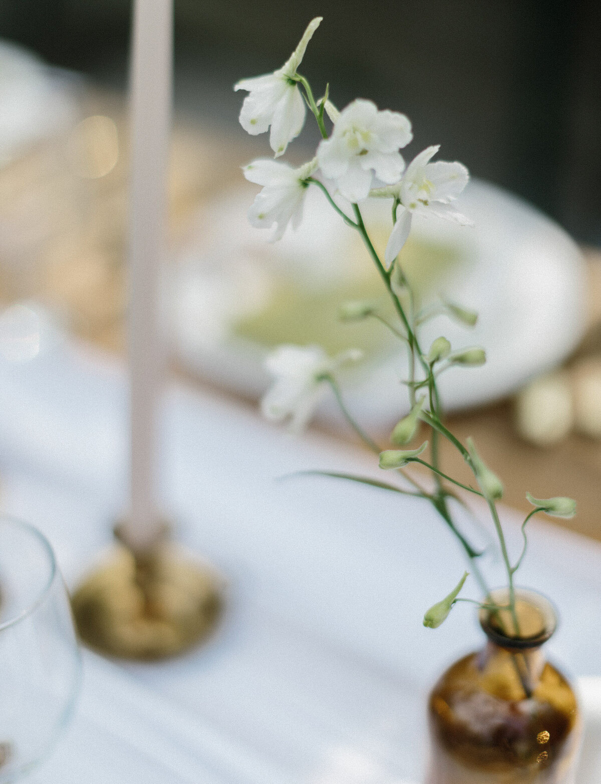 soft flower details on table at Glass House Community wedding, Michigan