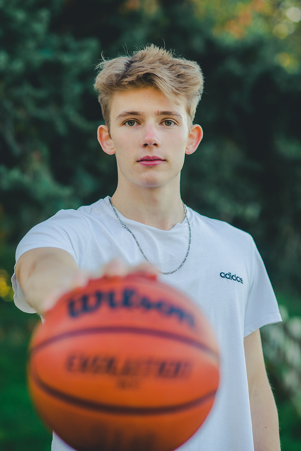 senior boy with basketball