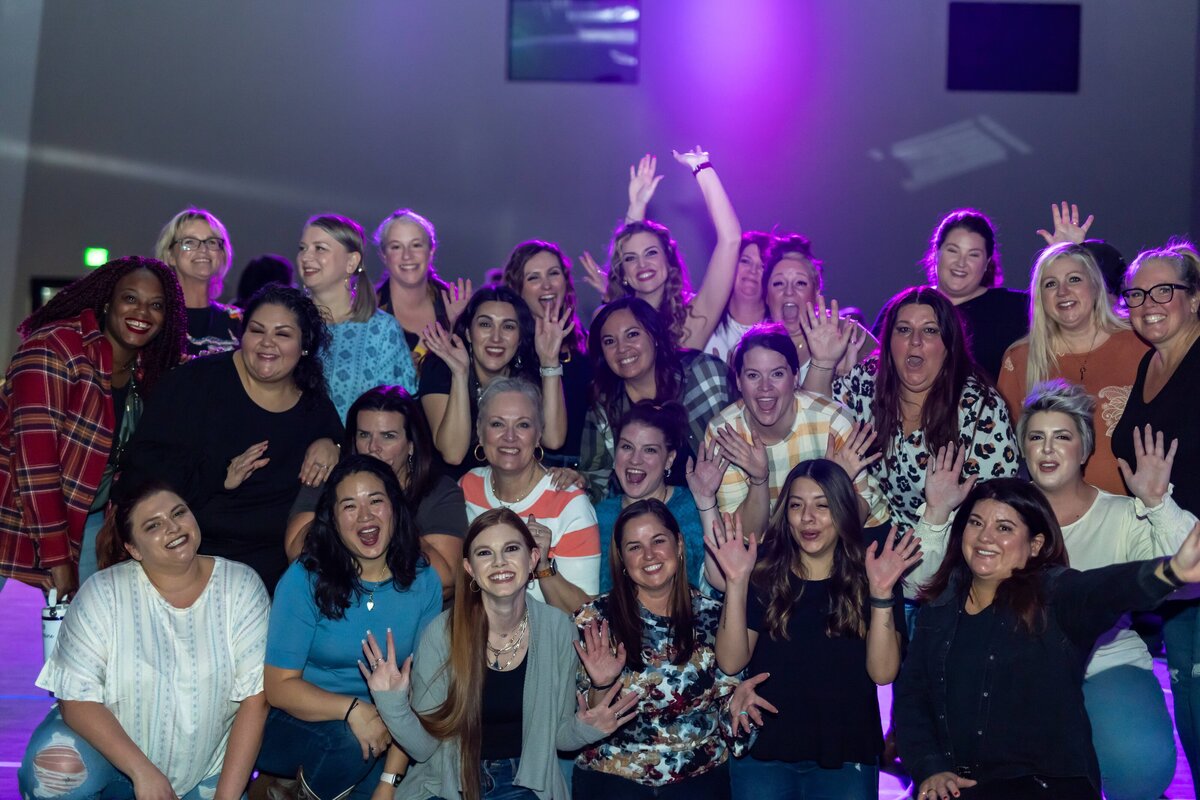 large group of people making silly faces at camera