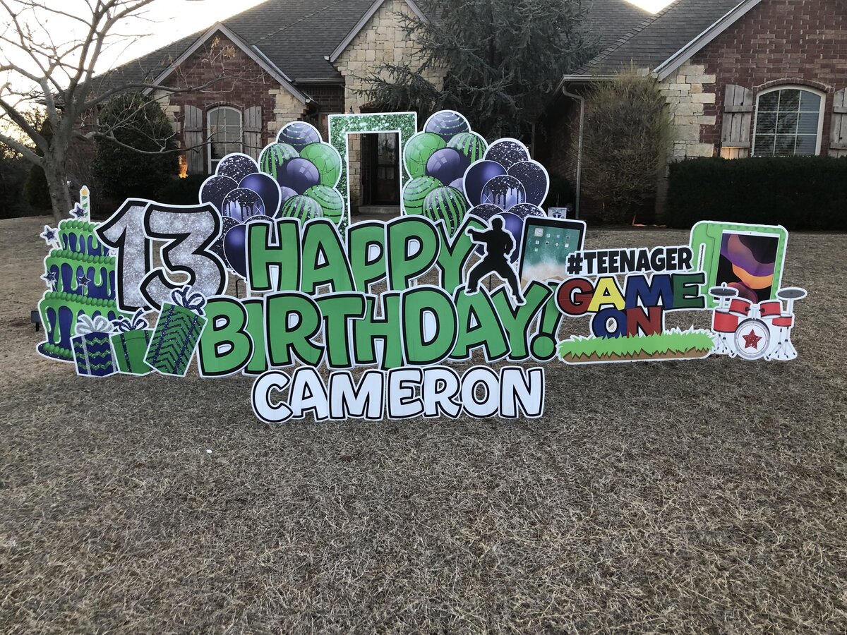 Custom birthday yard sign setup in Edmond, Oklahoma. Simply Sign It is a yard greeting rental company servicing Edmond, NW OKC, Piedmont, and Deer Creek. Order a yard greeting for birthdays, graduation, anniversary, back-to-school, and birth announcements. Design features  drums, gaming, and electronics.