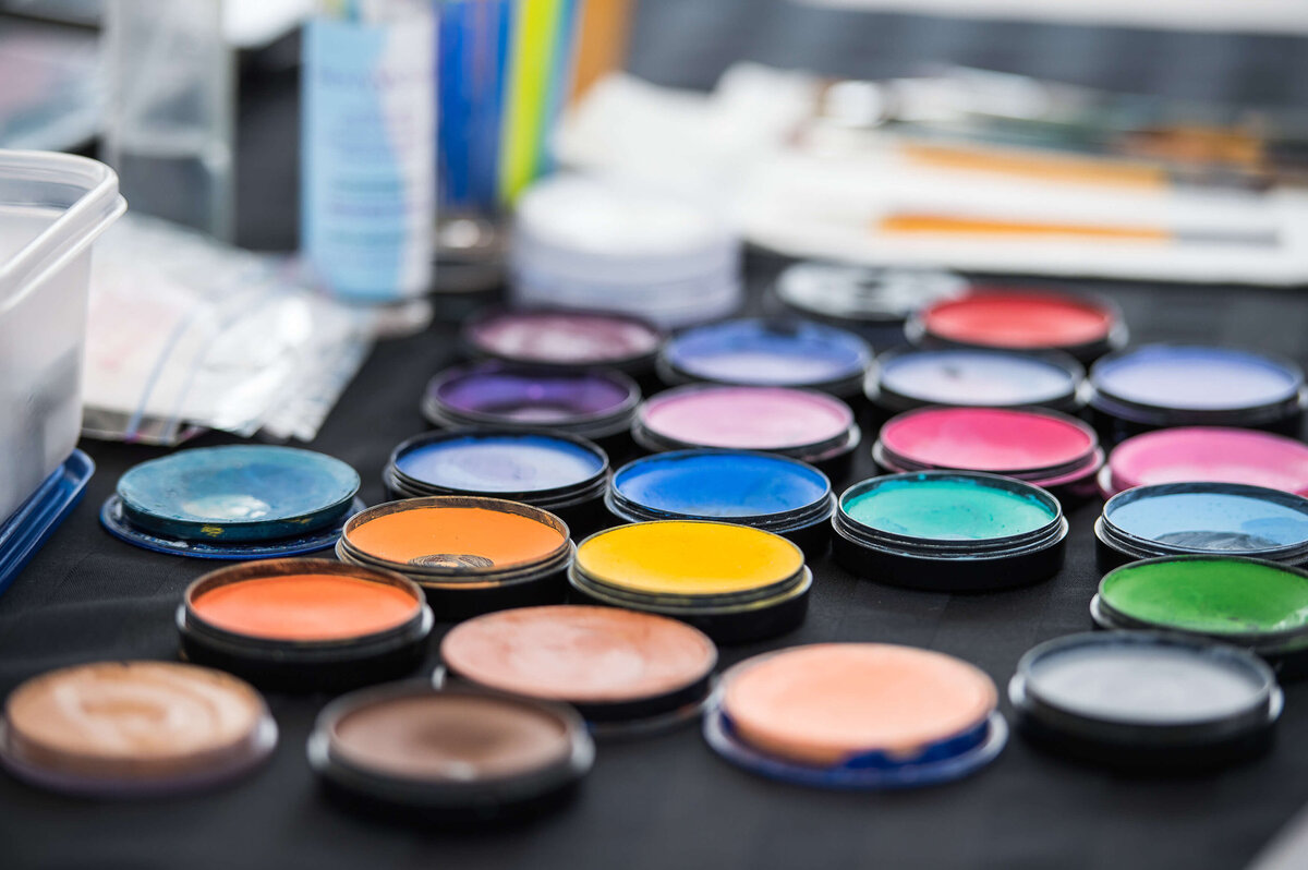Ottawa event photos showing the colourful face makeup used for painting faces at a corporate children's event.  Captured by JEMMAN Photography COMMERCIAL