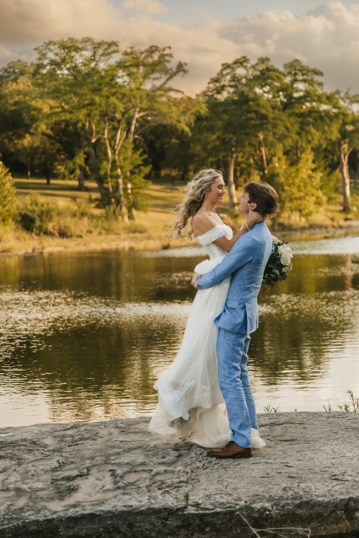 bride-and-groom-pose-at-river