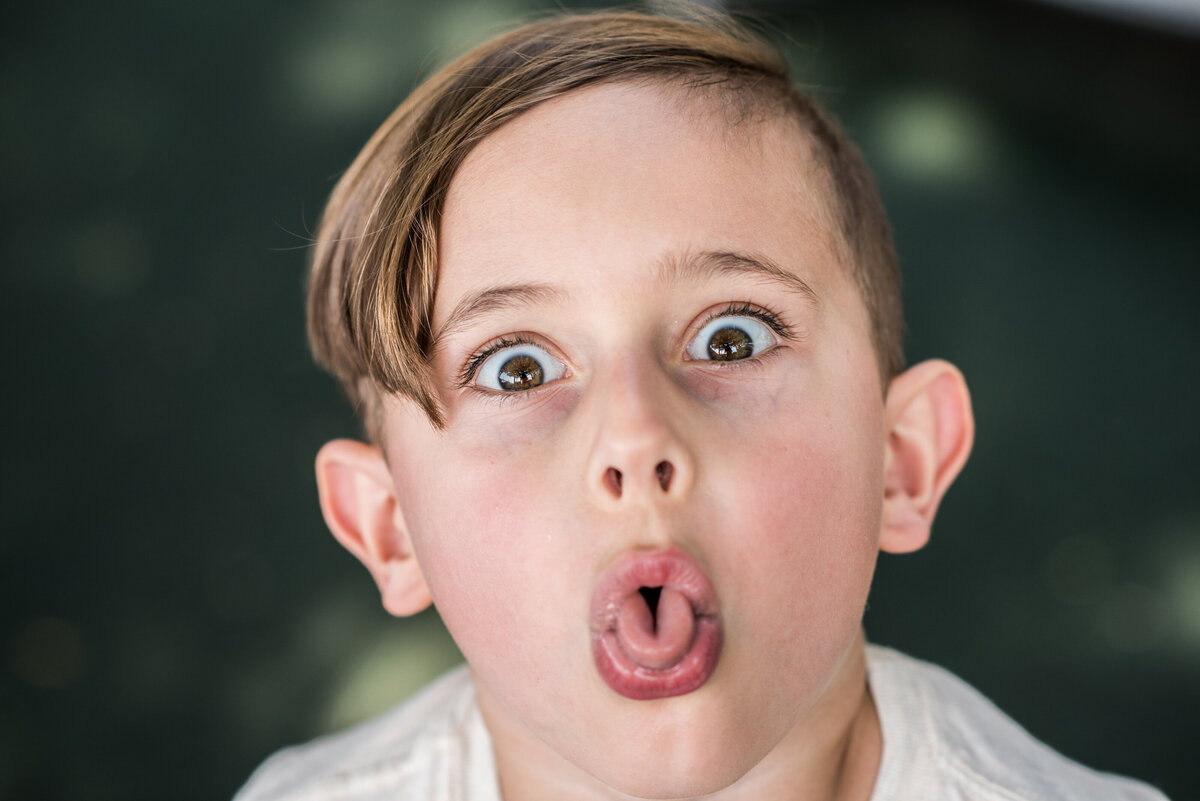a small child sticking their tongue out