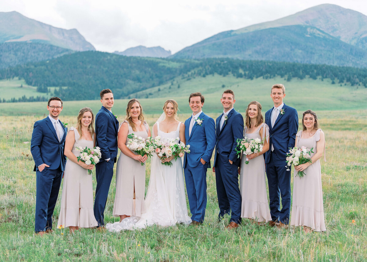 With the men in navy suits and the ladies in mauve, this small bridal party was a stylish group