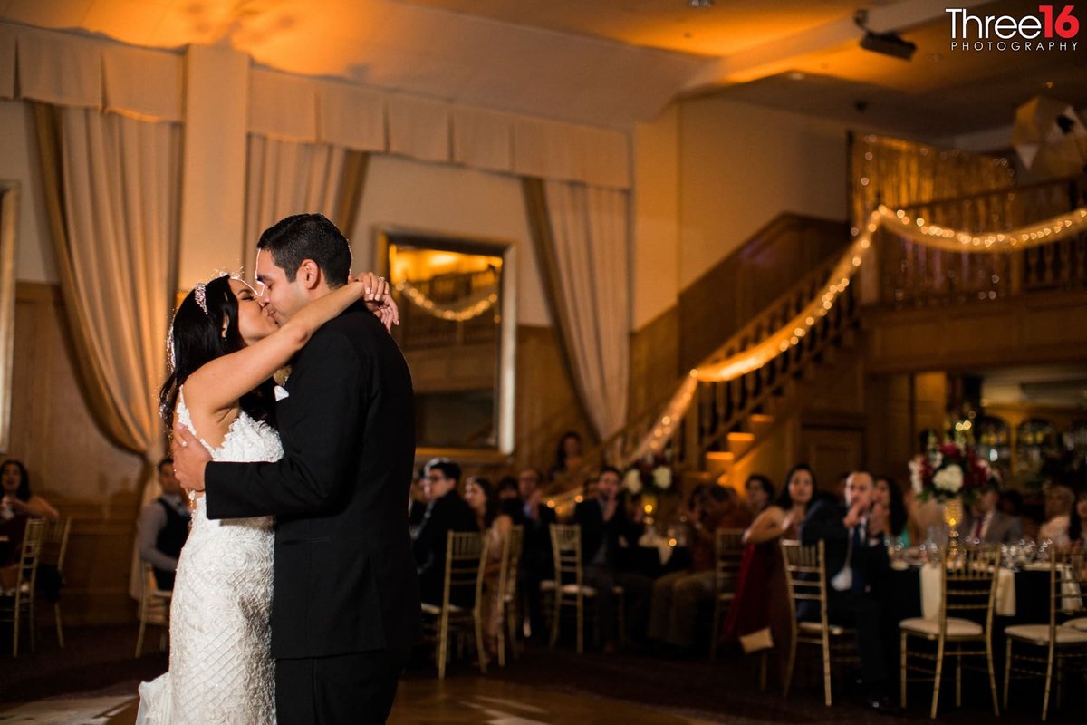 Bride and Groom share a kiss during the first dance