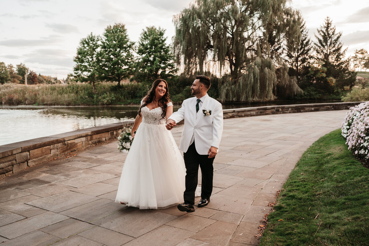 bride and groom walking at turning stone casino and venue
