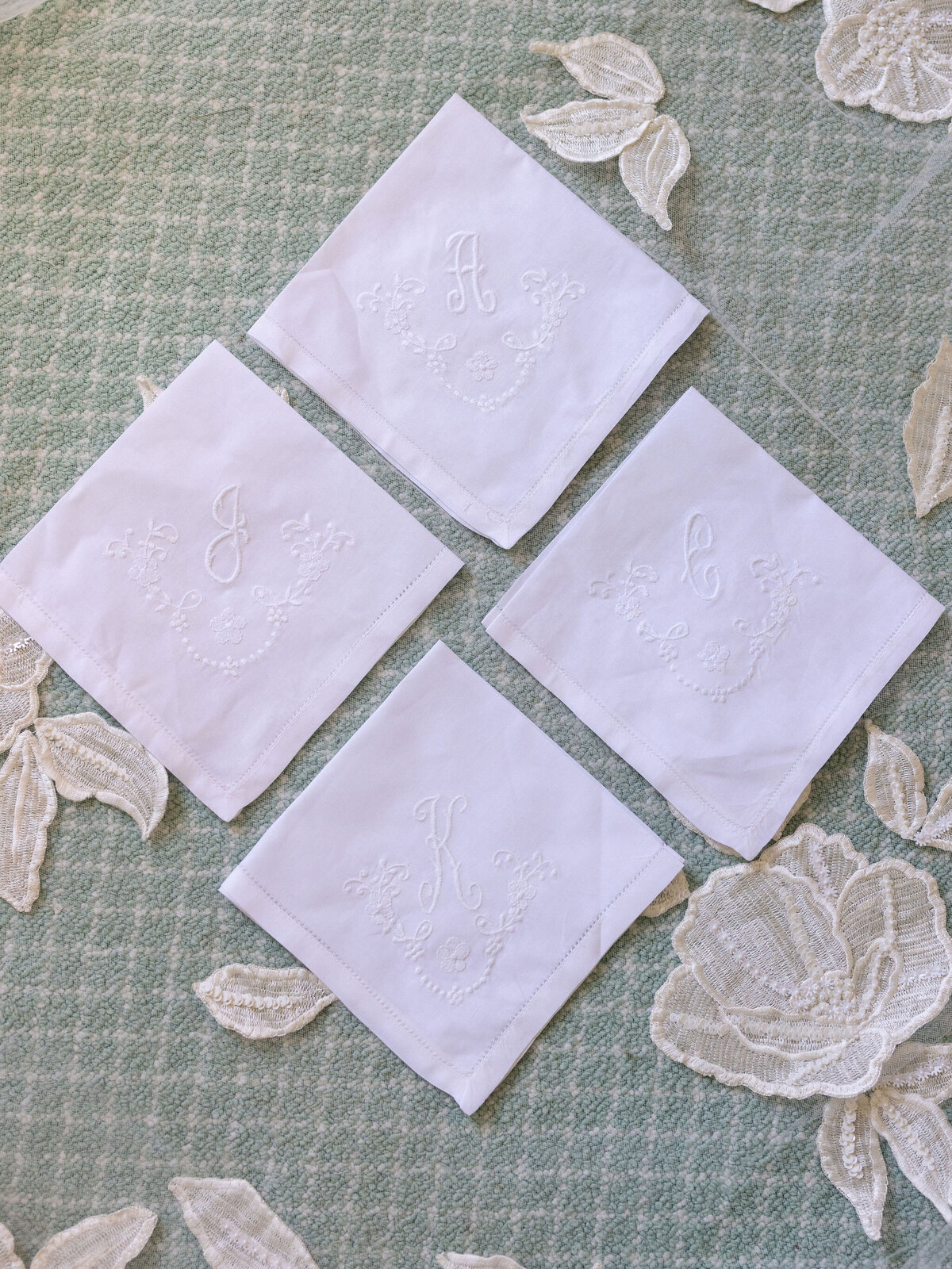 Close up of the embodied napkins with the initials of the bride and groom. 