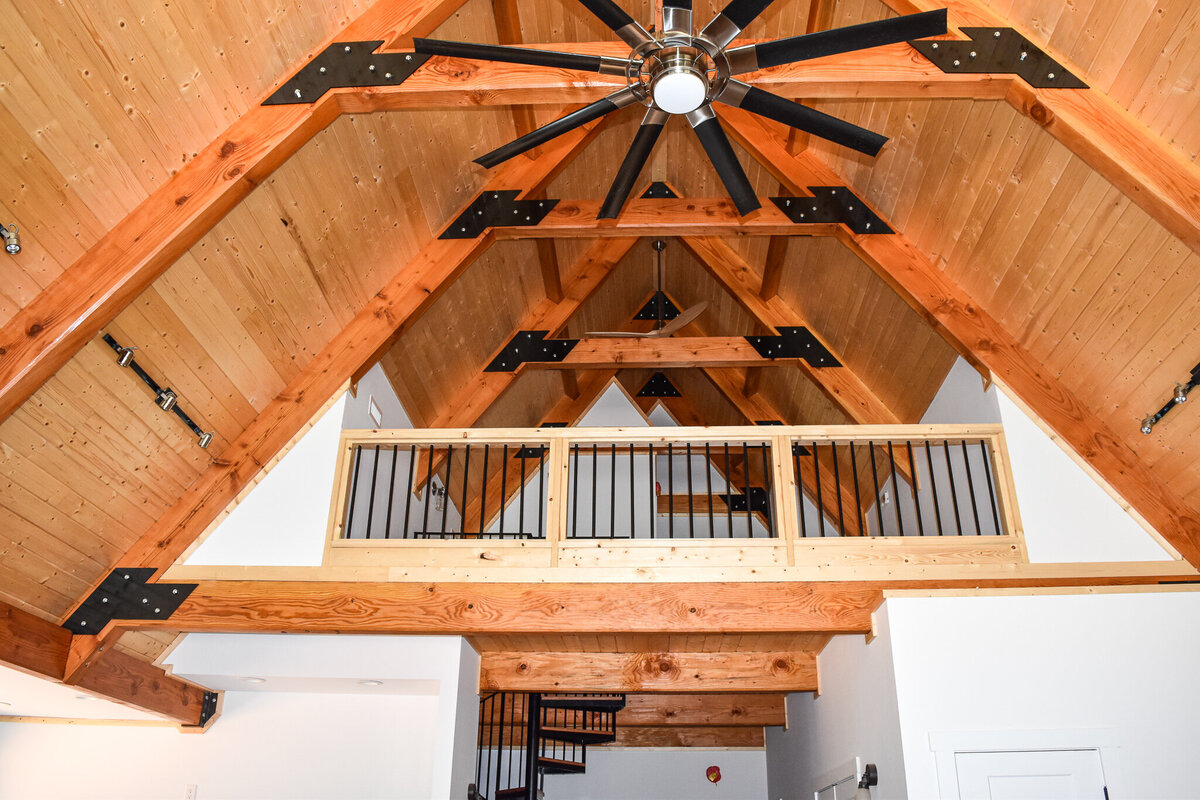 Explore stunning timberframe custom homes built by Ryan Noble Construction. Featuring exposed wooden beams, vaulted ceilings, and rustic charm, each home is a perfect blend of craftsmanship and natural beauty. Discover how timberframe construction adds warmth and elegance to your dream home