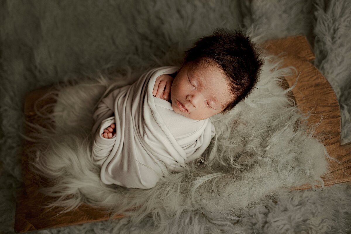 Close-up of newborn baby boy during studio session with Haili Barton Photography