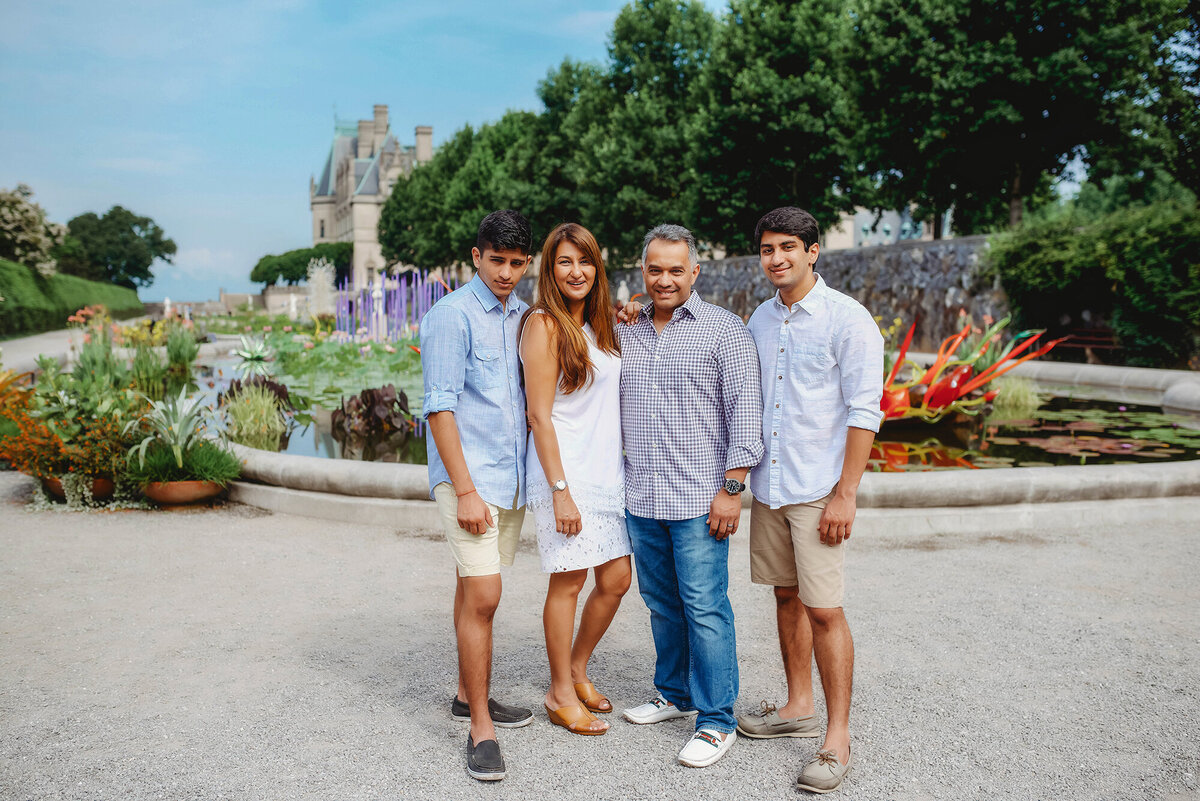 Family embraces during Family Photos at Biltmore Estate in Asheville, NC.