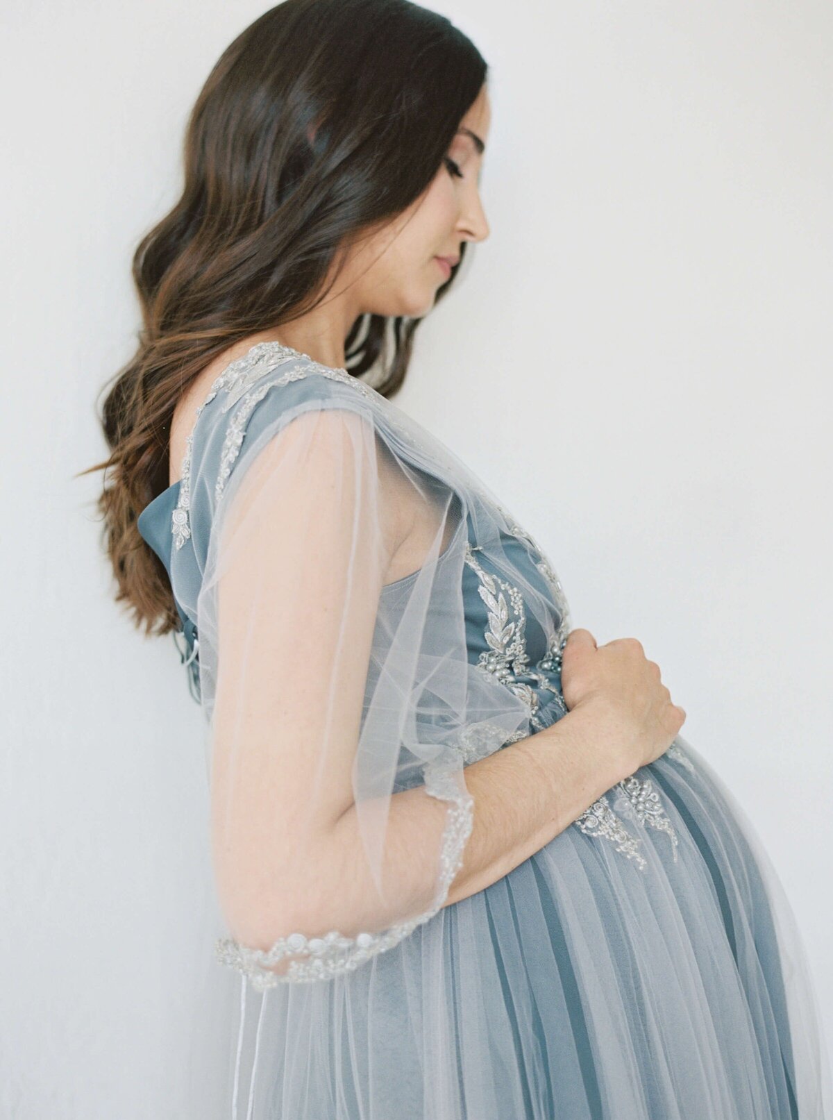 Pregnant Woman in blue dress taken by maternity photographer in san francisco