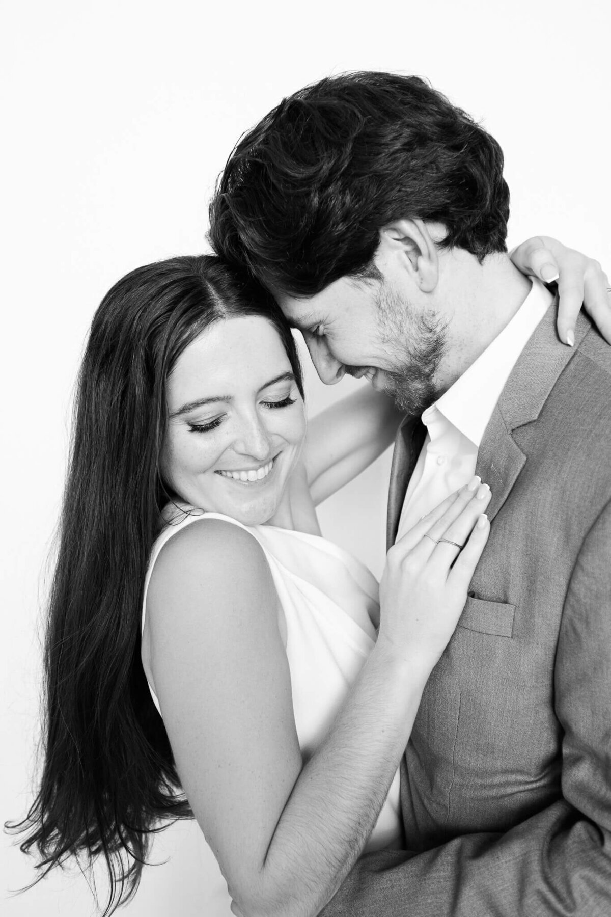A couple shares a quiet, intimate moment during their black and white portrait by Monochrome Portraits, a Phoenix photo booth rental specializing in elegant event photography.”