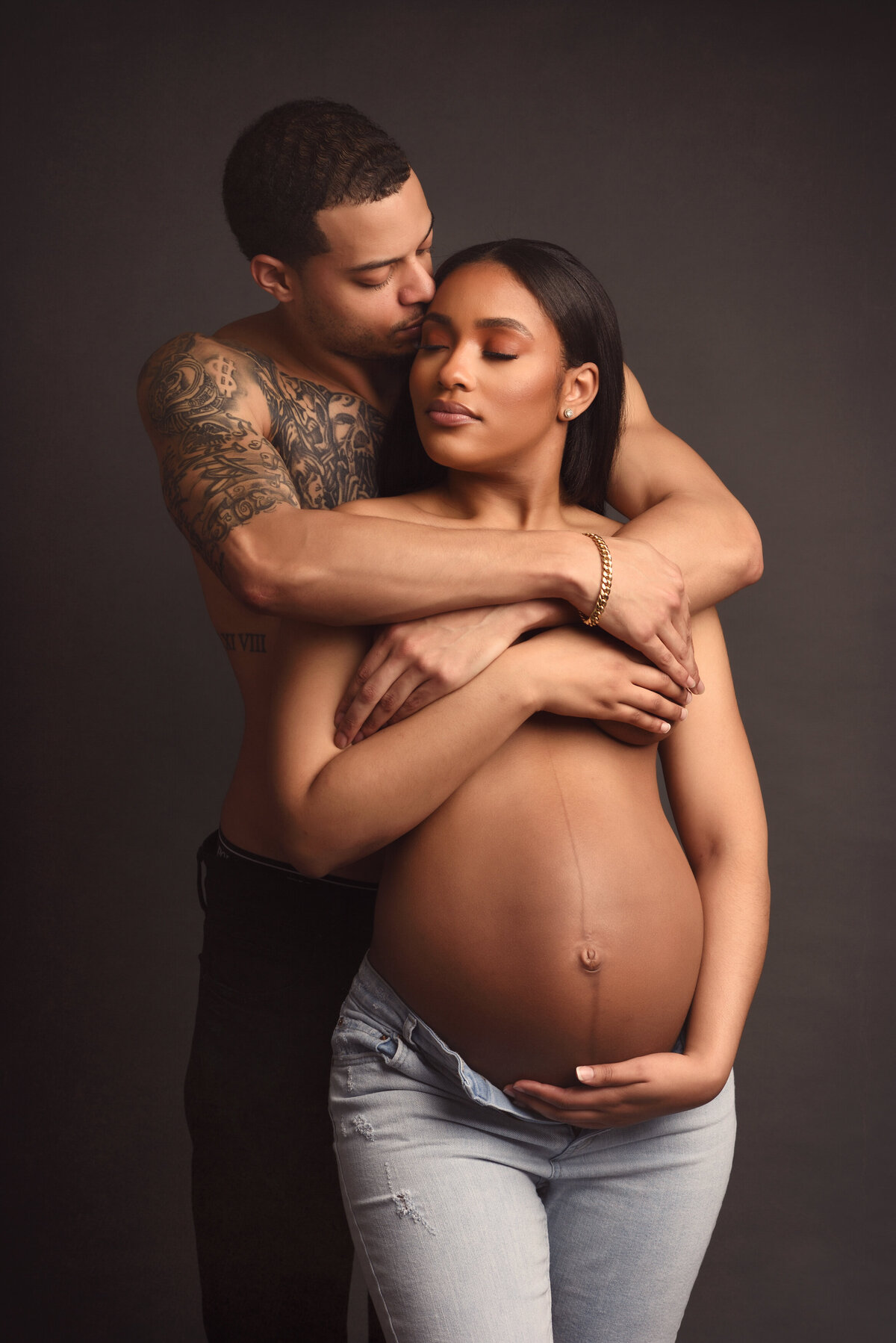 Couple Kissing during a Maternity Session