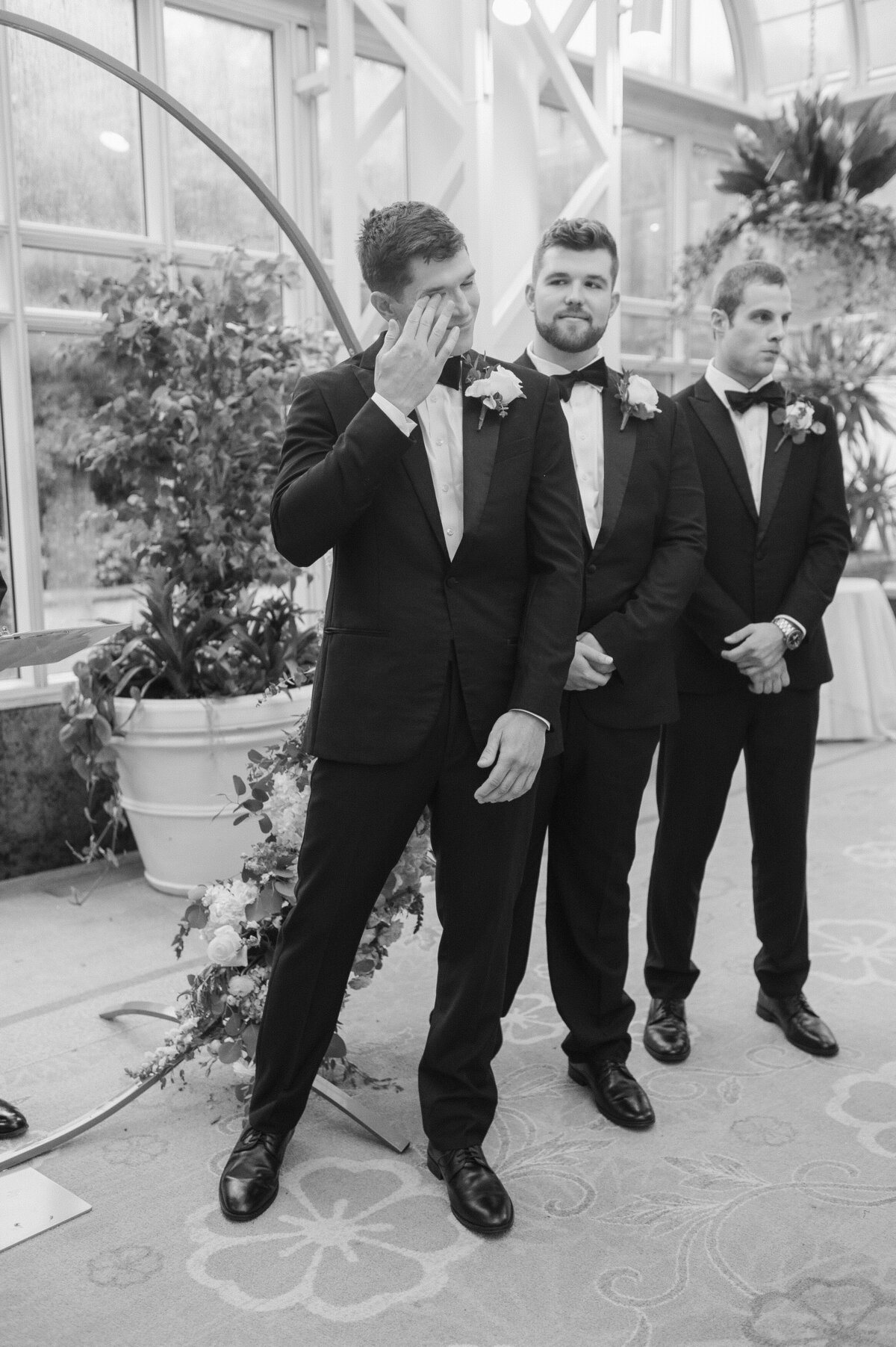 groom crying at the ceremony