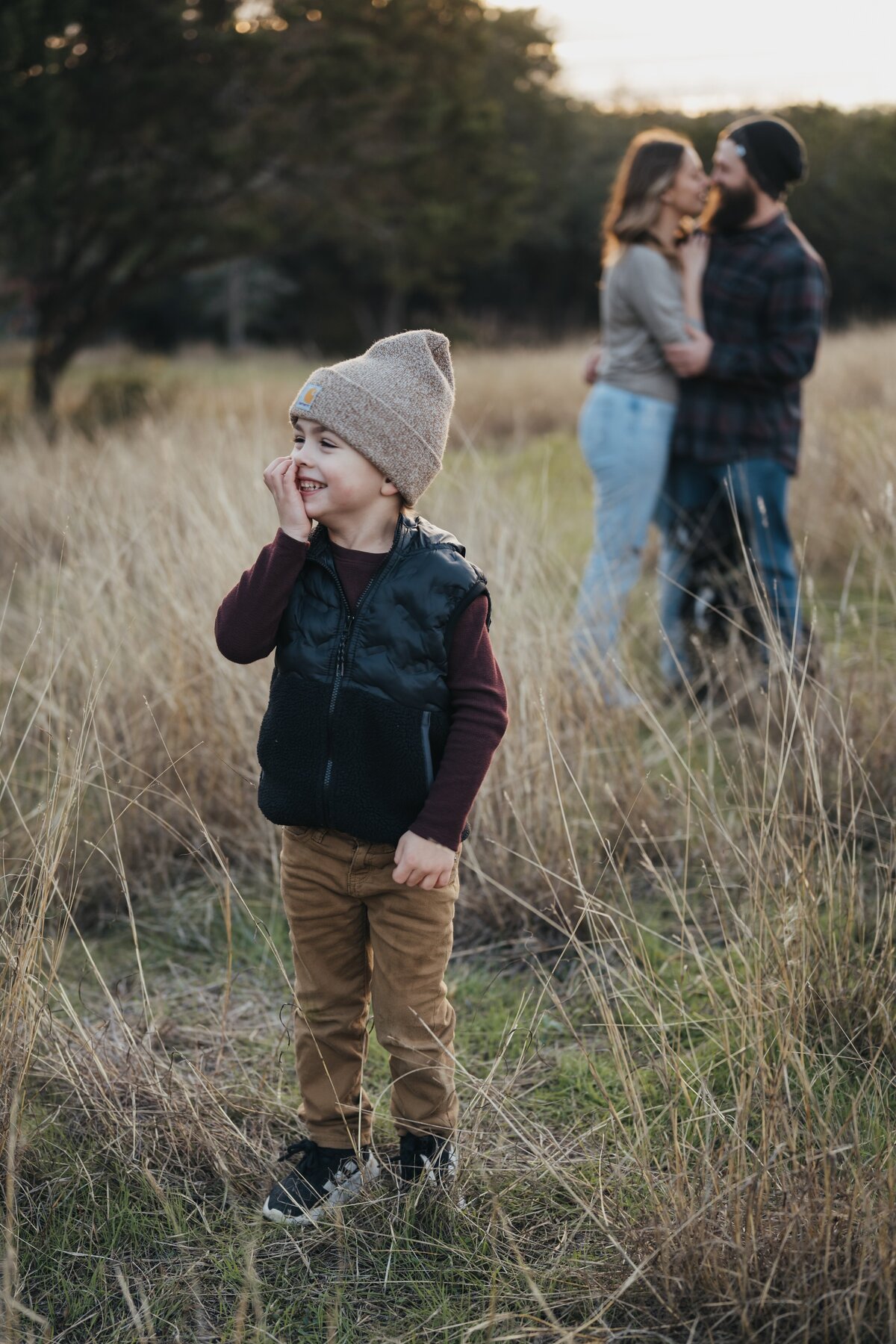 kid-laughing-with-parents