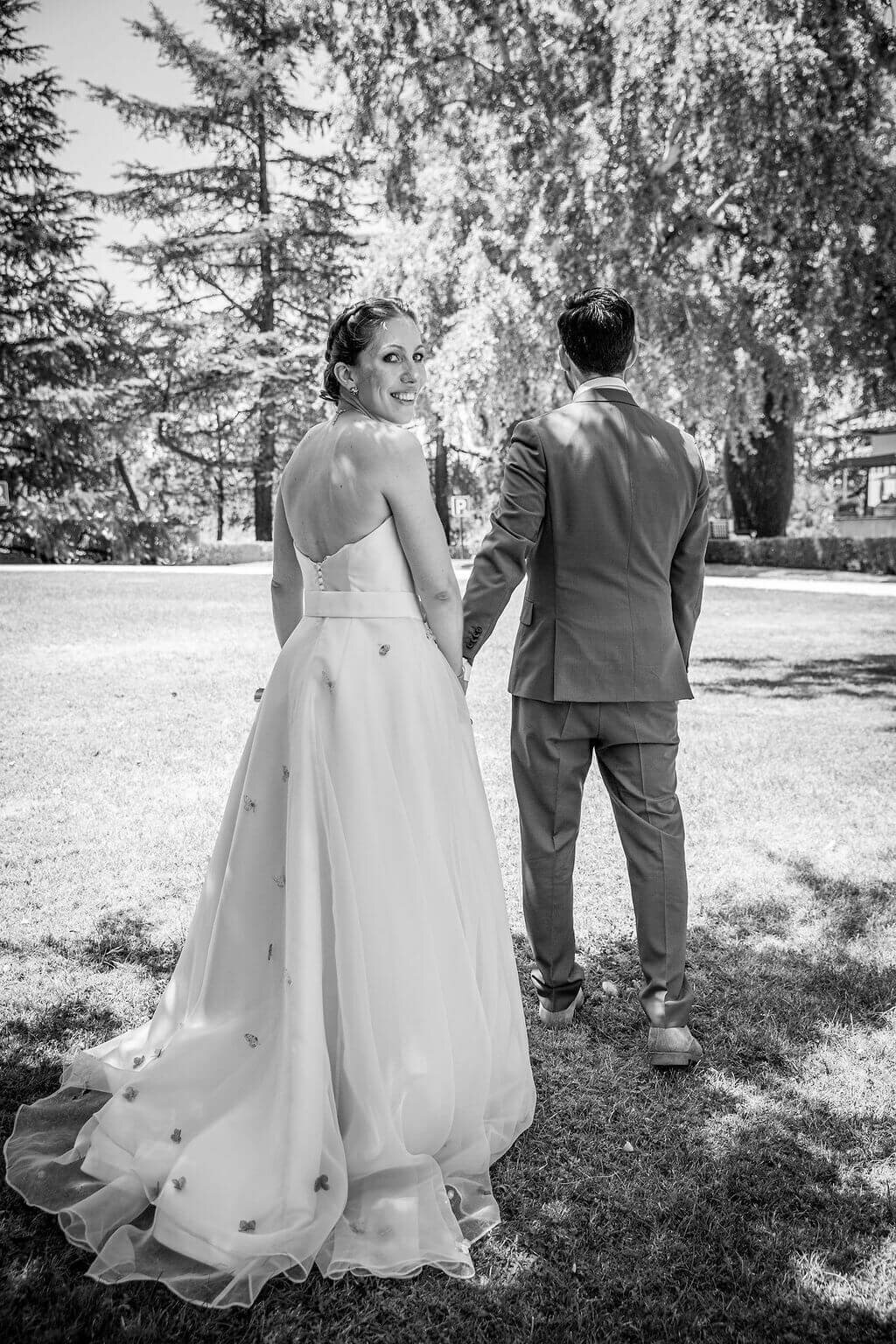 Bride looking over shoulder by destination wedding photographer Peach Portman
