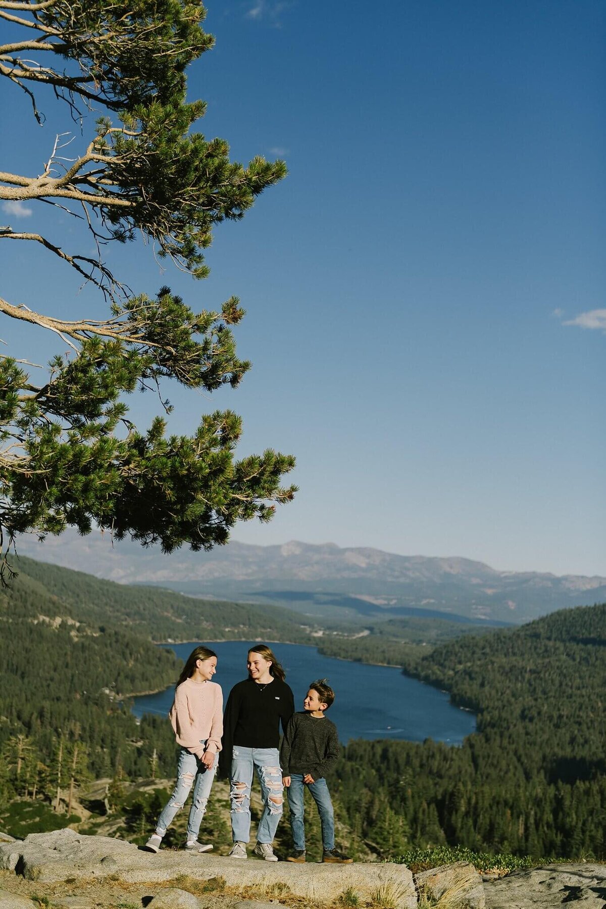 kids together close with donner lake behind during fall family session