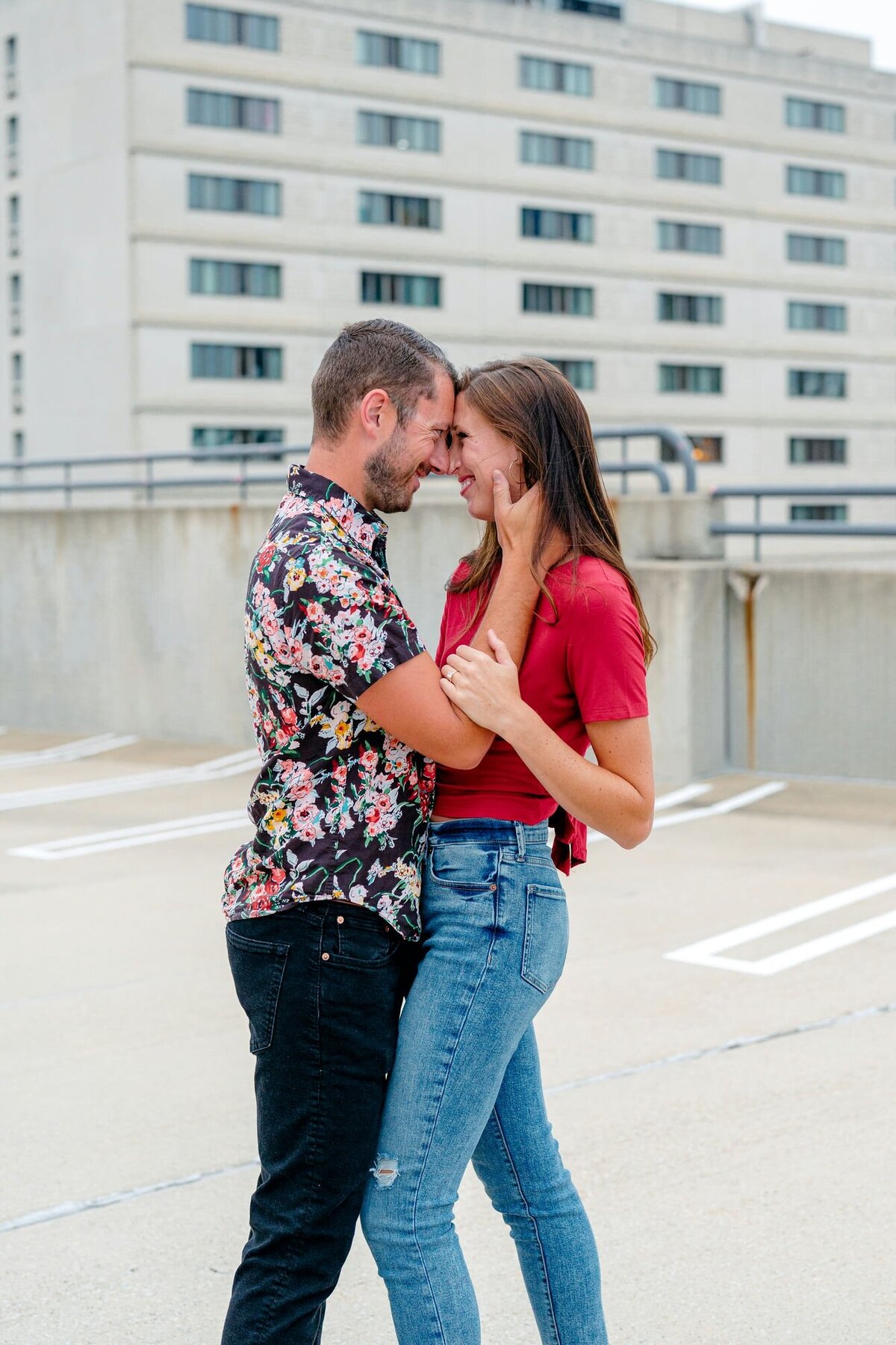 couple-walking-rooftop-holding-hands-engagement