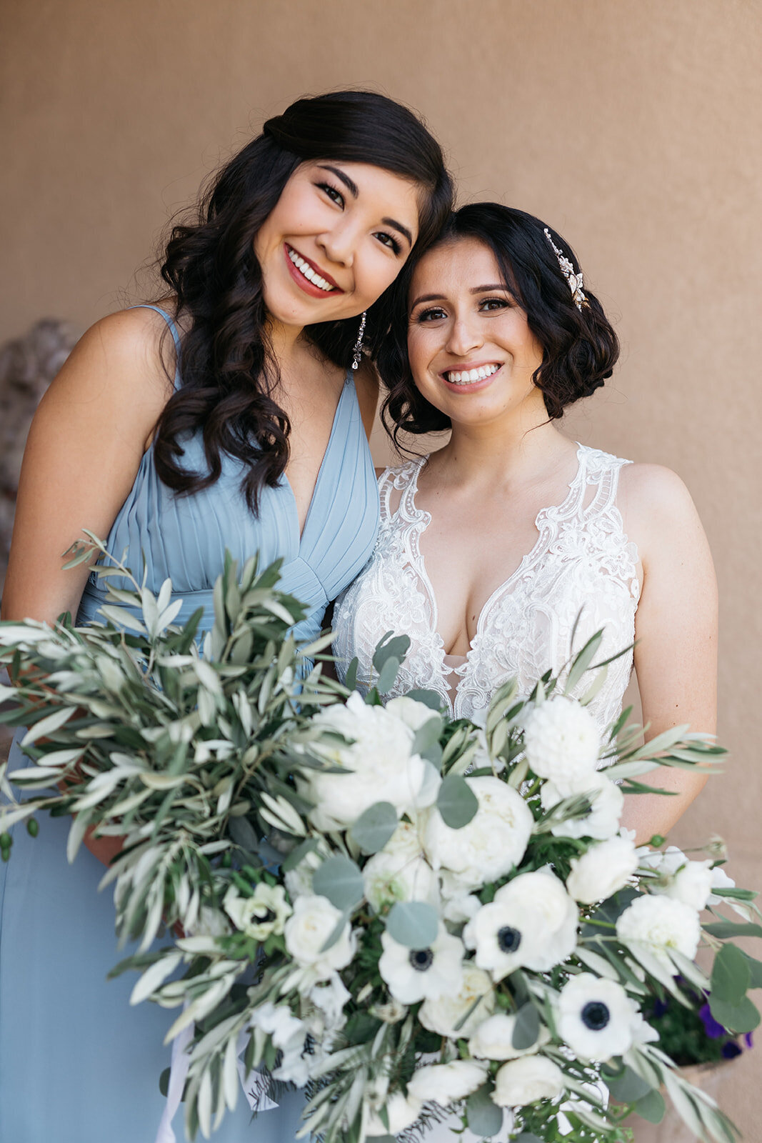 Bride, bridesmaid, and bouquets | Bella Fleur