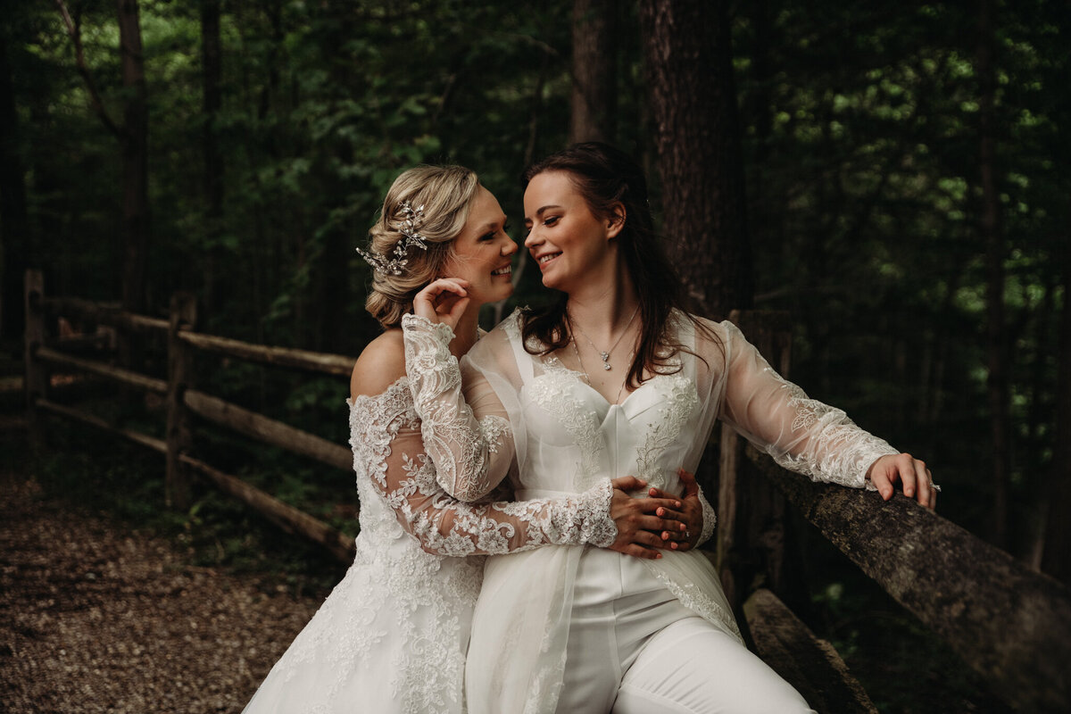 Brides embrace in a summer forest in Ohio
