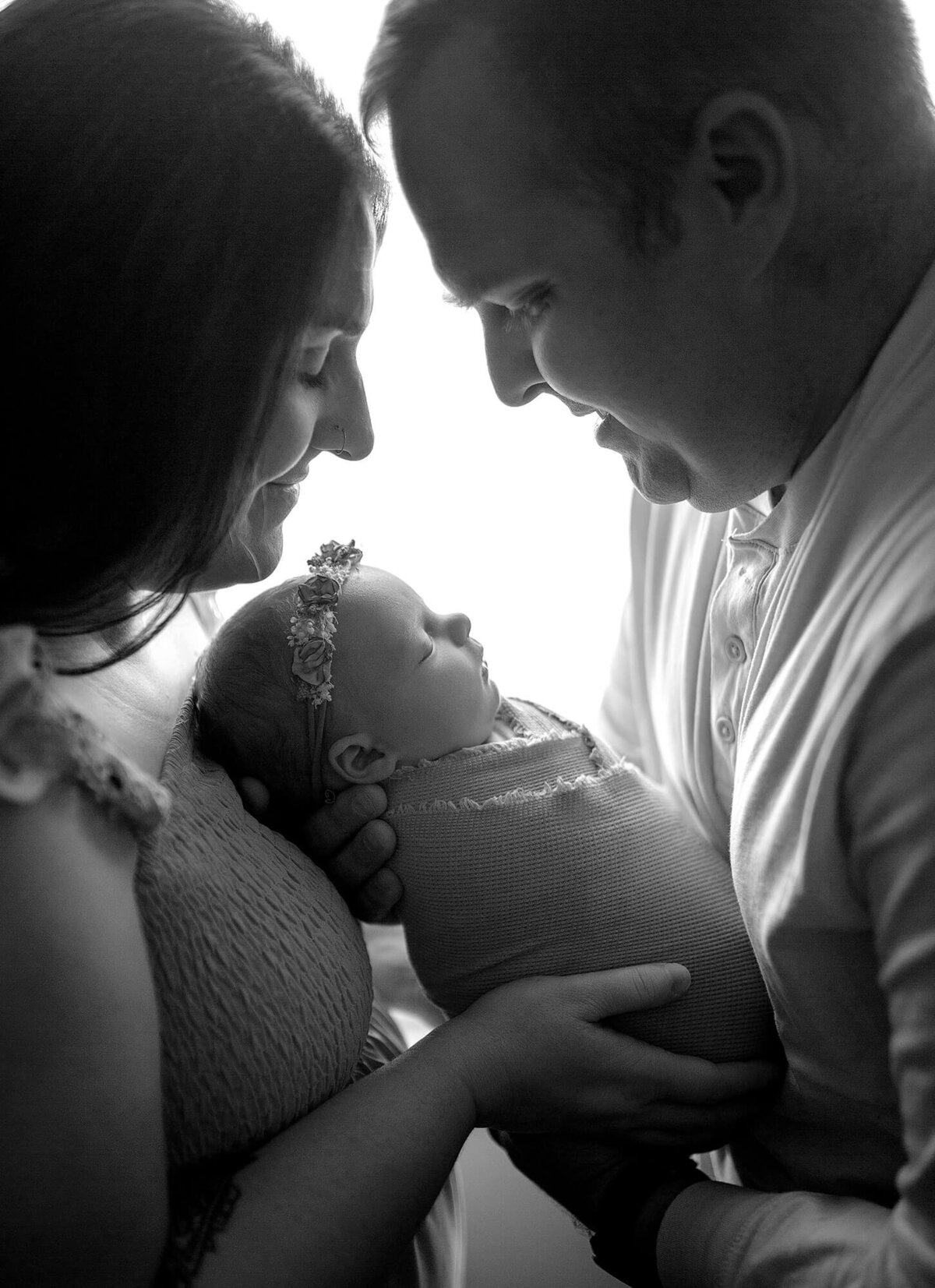 close-up Black and white family portrait using backlighting in the studio newborn session 