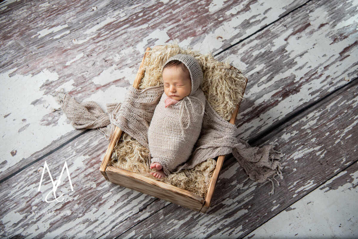 Baby-Girl-In-Brown-tan-Wrapped-in-Bed-and-Basket-with-Bonnet-Newborn-Photos-4