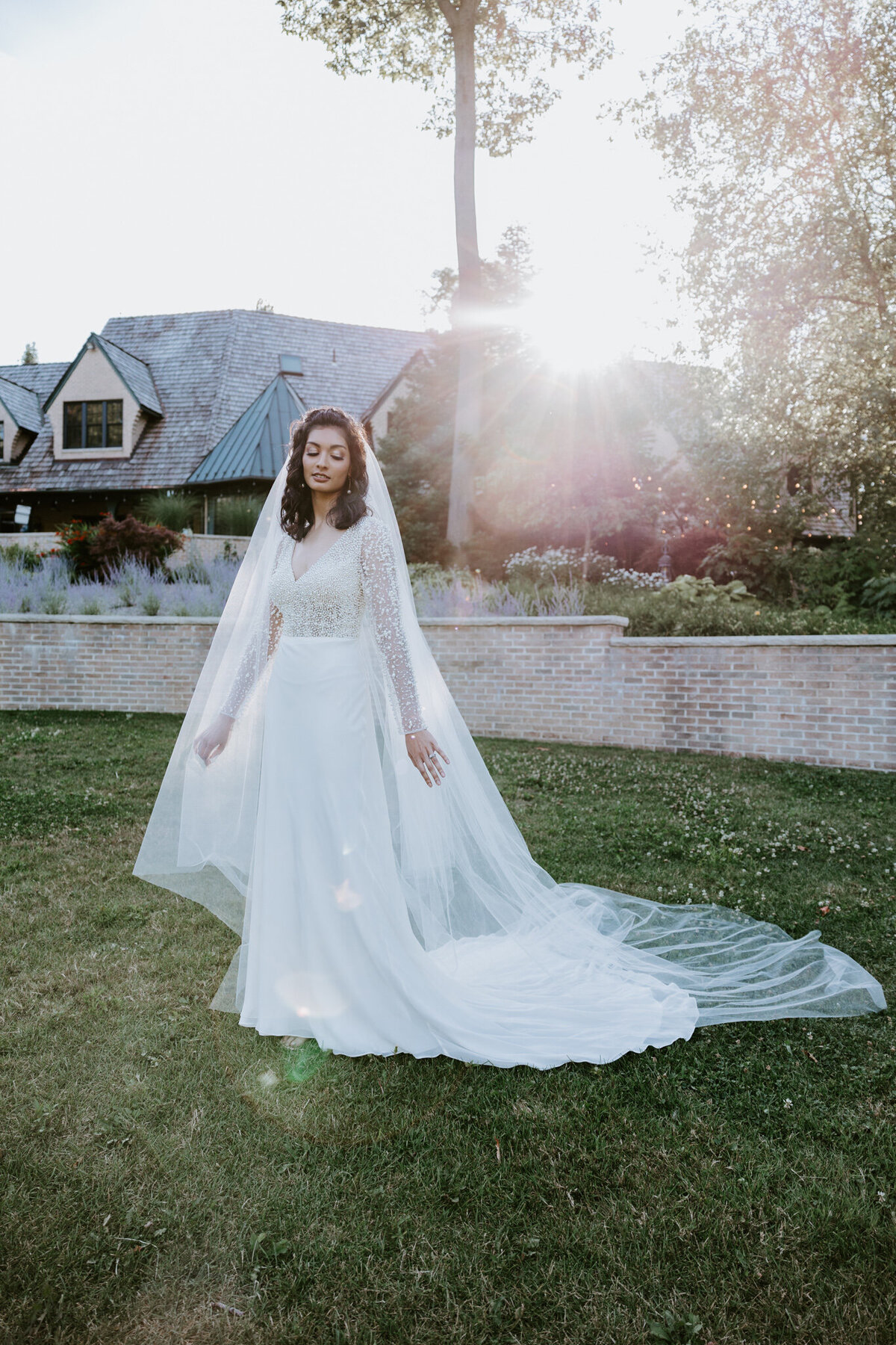 bride standing in the garden of basil place