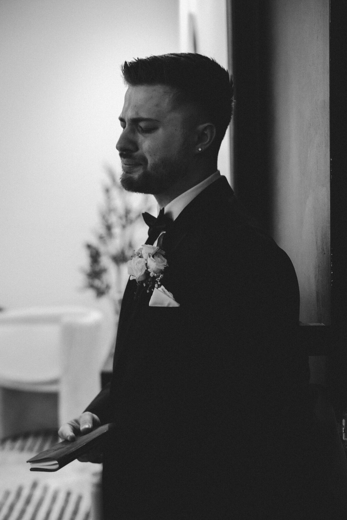 Groom getting emotional during his first look with bride 